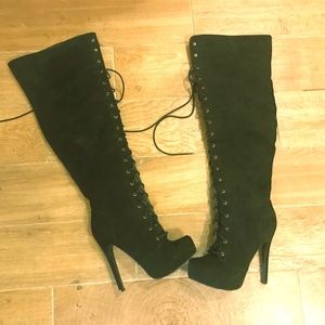 daring black suede knee length, high heel boots
